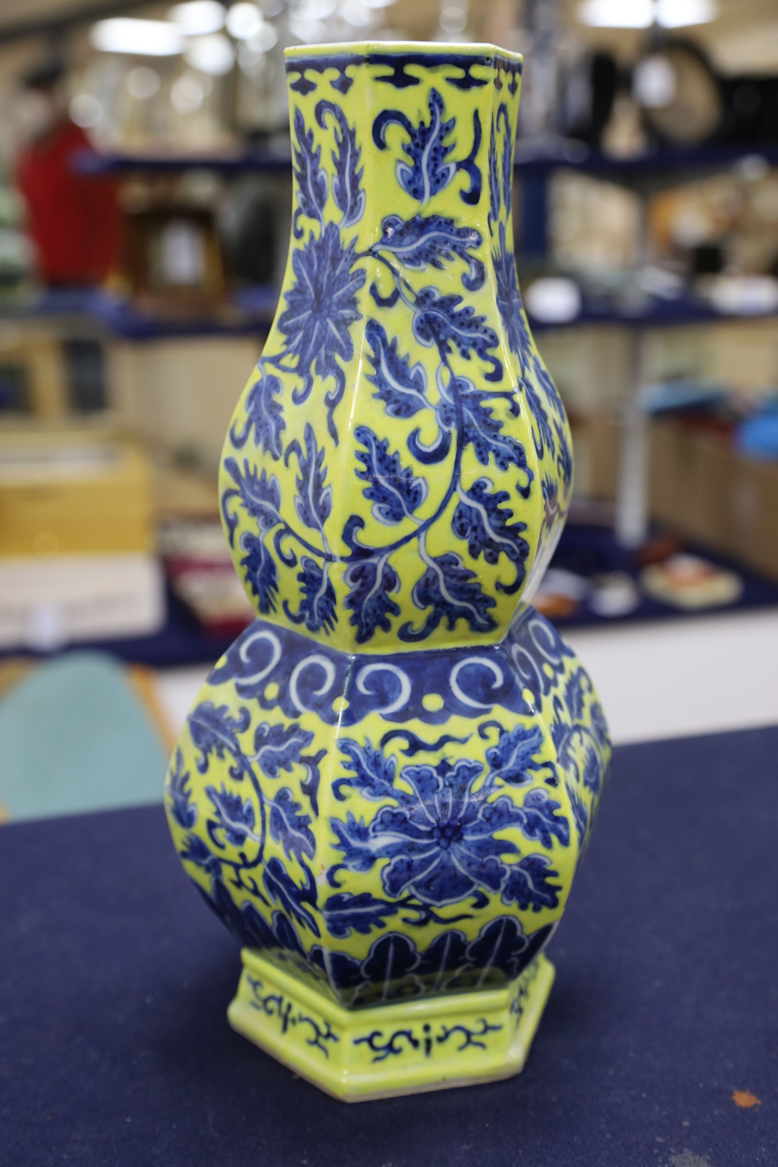 A Chinese underglaze blue yellow ground hexagonal vase, early 20th century, some restoration 35cm